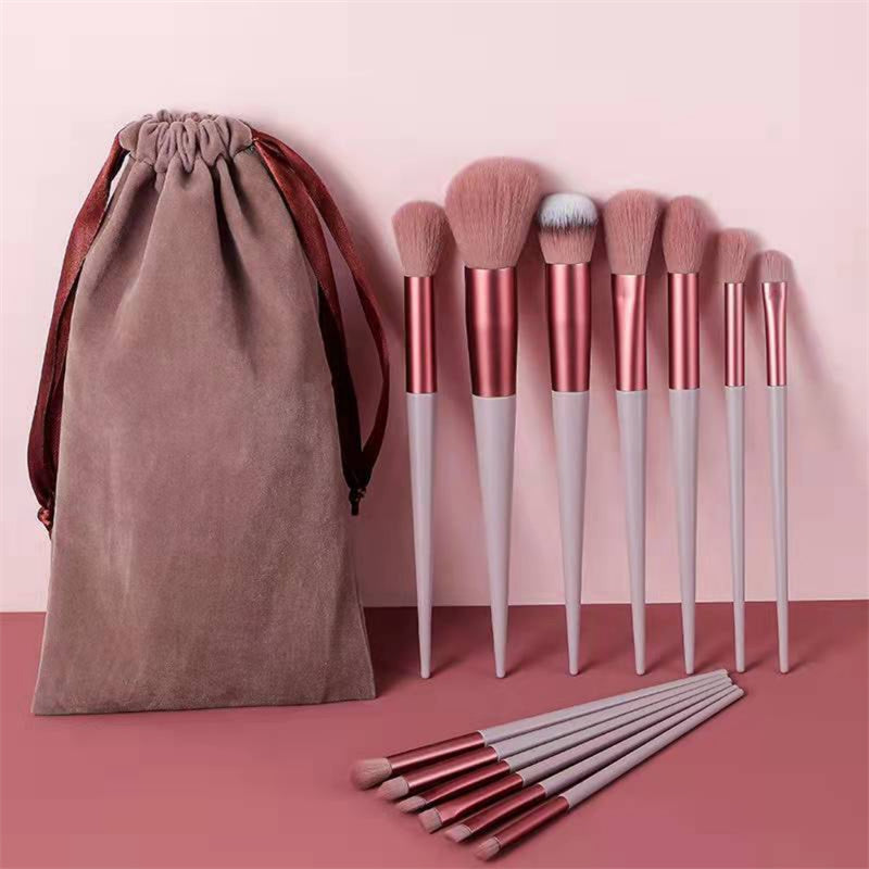 Professional makeup brush set displayed with all 13 beauty tools