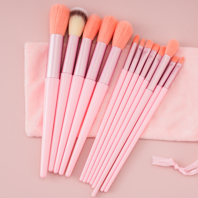 Green 13-piece makeup brush set with soft synthetic fibers